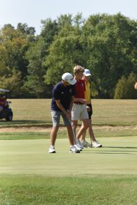 Ottawa-Glandorf's Davis Maag watches a putt roll towards the cup on the 17th green at the Western Buckeye League tournament Thursday.