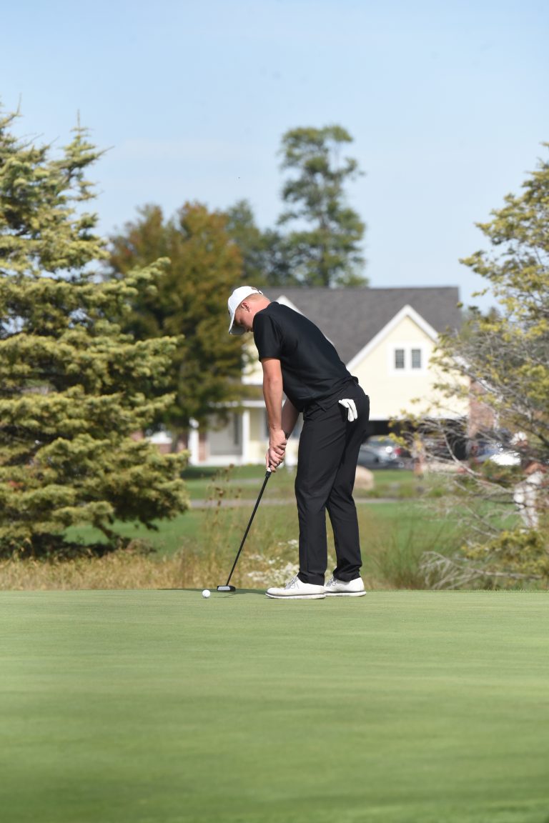 Kalida's Paul Stechschulte watches a putt roll towards the cup on the ninth hole during the Division III district tournament Thursday. Stechschulte finished with a 77 to help the Wildcats to the state tournament.